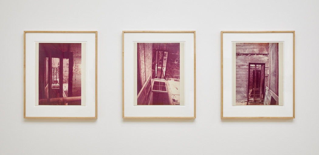 Three framed color photopraphs by Gordon Matta-Clark depciting doors and floors. 