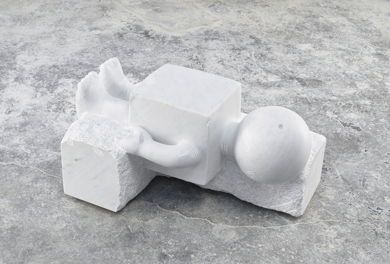 Otterness, reclining cube, 2014, white carrara marble and limestone, unique, 14 x 26.5 x 18