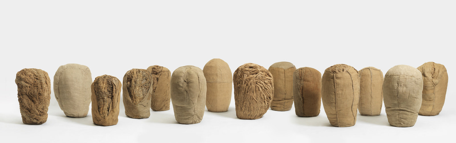 Abakanowicz, heads (14 pieces), 1973 ­75, burlap and hemp rope, non 30 966, by grubb