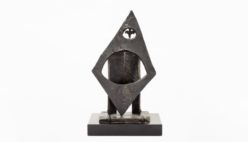 a bronze sculpture of a strange rhombus with voids 