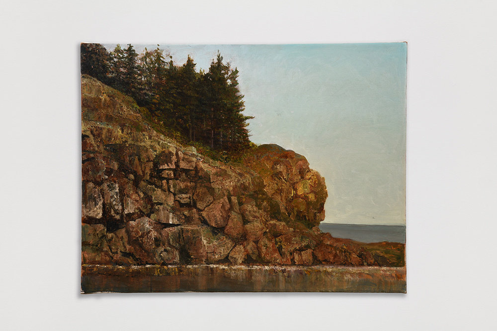 An oil on canvas painting by Vincent Desiderio of a Maine landscape. A rocky cliff protrudes from the left of the painting covered in a thick bed of dark evergreen trees. In the foreground sits a body of water that reflects the rock formation above. The cliff is set against a serene sky rendered in diffuse hues of blue.